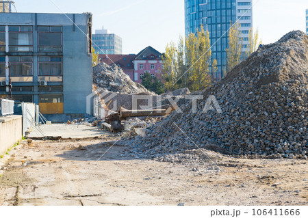 Large hills and piles of sand, gravel, crushed stone of white, gray and black color. Large hills and piles of sand, gravel, crushed stone of white, gray and black color. 106411666