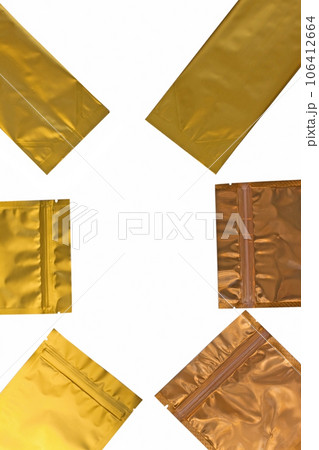 Golden metalized side gusset pouch bag isolated on white background. Empty blank foil coffee packaging template mockup. 106412664