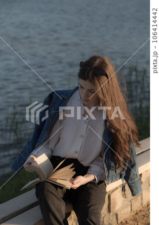 Portrait of a beautiful girl with a book. 106414442