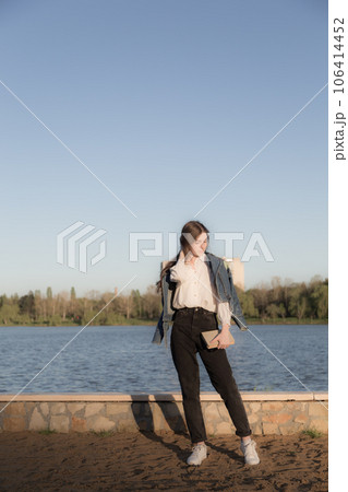 Portrait of a beautiful girl with a book. 106414452