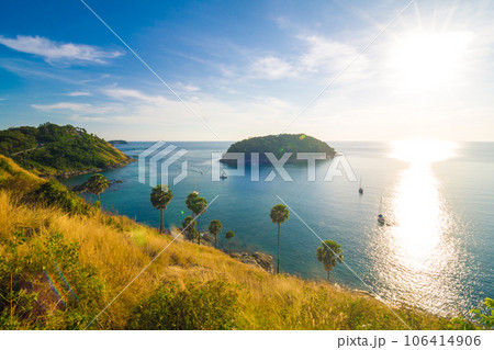 Sunset on Phuket island viewpoint turquoise sea water with yellow grass Sunset on Phuket island viewpoint turquoise sea water with yellow grass 106414906