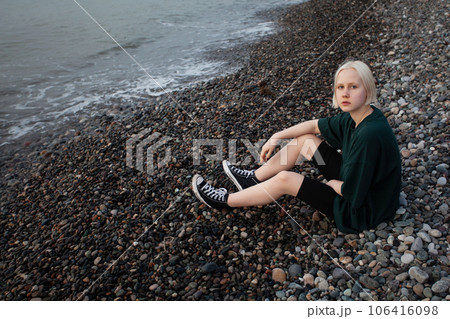 Pretty young adult woman outdoor portrait 106416098