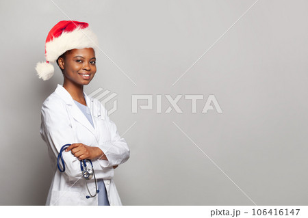Cheerful Christmas woman doctor Santa on white background Cheerful Christmas woman doctor Santa on white background 106416147