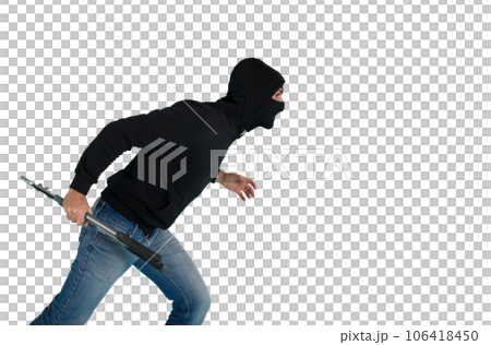 Thief with balaclava acts in silence to steal apartments with wire cutters in hand Thief with balaclava acts in silence to steal apartments with wire cutters in hand 106418450