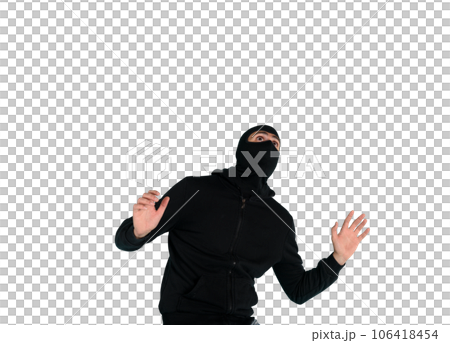 Thief with balaclava acts in silence to steal apartments with wire cutters in hand Thief with balaclava acts in silence to steal apartments with wire cutters in hand 106418454