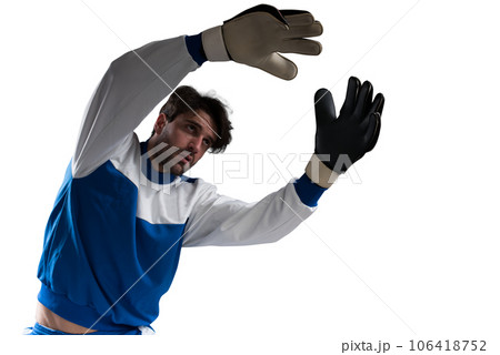 Goalkeeper catches the soccer ball during a football match 106418752