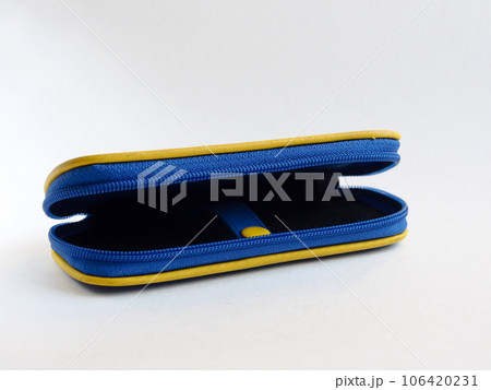 Case blue with yellow trim for items, close-up, isolated on a light background. Case blue with yellow trim for items, close-up, isolated on a light background. 106420231