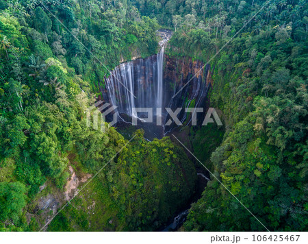 Aerial top view from above of Tumpak Sewu ,also known as Coban Sewu, 120m high waterfall in Malang regency, East Java, Indonesia 106425467