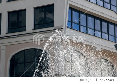 High jets of water fountain in the city High jets of water fountain in the city 106425584