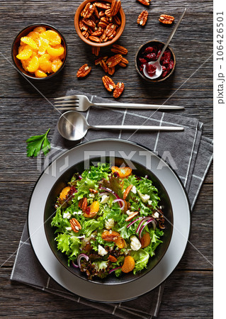 Mandarin Orange Salad in black bowl, top view Mandarin Orange Salad in black bowl, top view 106426501