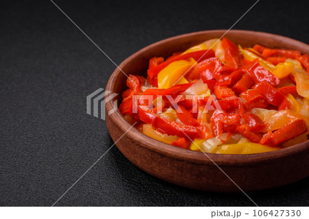 Delicious fresh saute sweet bell pepper slices with onion, salt, spices and herbs Delicious fresh saute sweet bell pepper slices with onion, salt, spices and herbs 106427330
