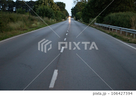empty asphalt road at sunset 106427394