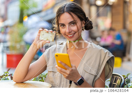 Woman use credit bank card smartphone transferring money, online shopping order food drink delivery Woman use credit bank card smartphone transferring money, online shopping order food drink delivery 106428104