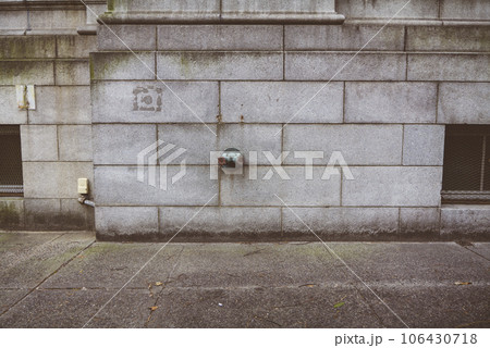 Fire hydrant water pipe, mounted in a building wall. Manhattan USA 106430718