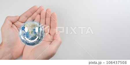 Hands holding smile earth, save planet, earth day, sustainable living, ecology environment, climate emergency action, world environment day concept. Earth globe in hands. copy space Hands holding smile earth, save planet, earth day, sustainable living, ecology environment, climate emergency action, world environment day concept. Earth globe in hands. copy space 106437508