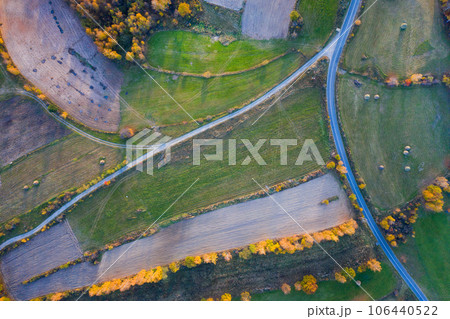 Aerial picture of a countryside village road 106440522