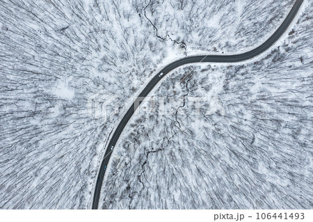 Aerial view of winter forest road 106441493