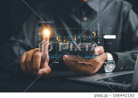 Investment planning and strategy concept. Trader man points at a virtual hologram stock on a screen, symbolizing the possibilities of stock market trading for business growth and financial success. 106442192