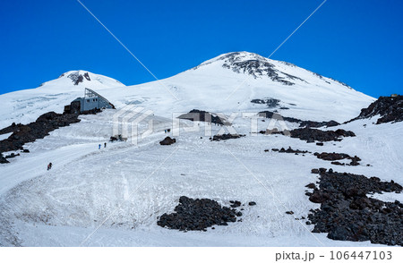 Elbrus, highest mountain in Europe. clear weather, snowy peaks. beautiful panorama of mountains against bright blue sky. mountaineering, trekking and mountain climbing Elbrus, highest mountain in Europe. clear weather, snowy peaks. beautiful panorama of mountains against bright blue sky. mountaineering, trekking and mountain climbing 106447103