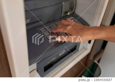 female hand enters pin code at ATM female hand enters pin code at ATM 106450887