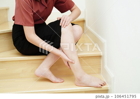 Asian lady woman injury from falling down on slippery surfaces stairs at home. Asian lady woman injury from falling down on slippery surfaces stairs at home. 106451795