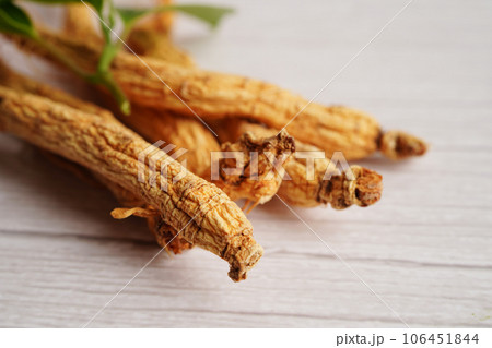 Ginseng roots and green leaf, organic nature healthy food. Ginseng roots and green leaf, organic nature healthy food. 106451844