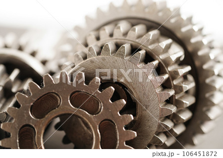 Metal gear wheel engine car and bike, mechanic industry concept. Metal gear wheel engine car and bike, mechanic industry concept. 106451872