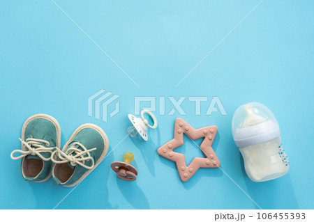Newborn necessities presented on soft blue, overhead shot with blank space Newborn necessities presented on soft blue, overhead shot with blank space 106455393