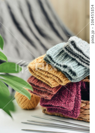 Hand-knitted woolen socks of different colors Hand-knitted woolen socks of different colors 106455854