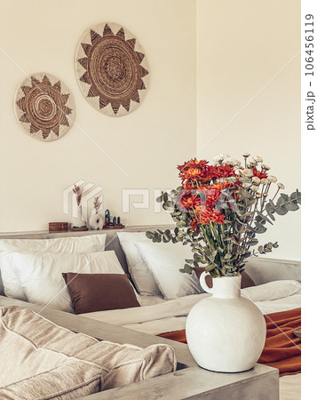 Bouquet of orange chrysanthemums in bedroom 106456119