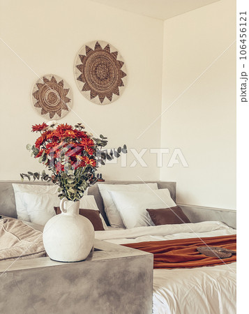 Bouquet of orange chrysanthemums in bedroom Bouquet of orange chrysanthemums in bedroom 106456121
