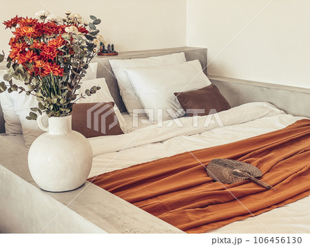 Bouquet of orange chrysanthemums in bedroom Bouquet of orange chrysanthemums in bedroom 106456130