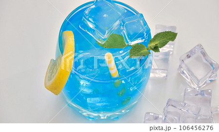 blue lemonade in a glass with ice blue lemonade in a glass with ice 106456276