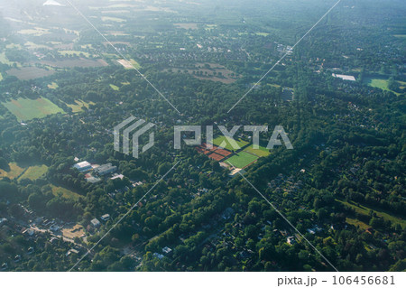 Autoroad  among tree alley  and some agricultural fields inside forest in Germany 106456681