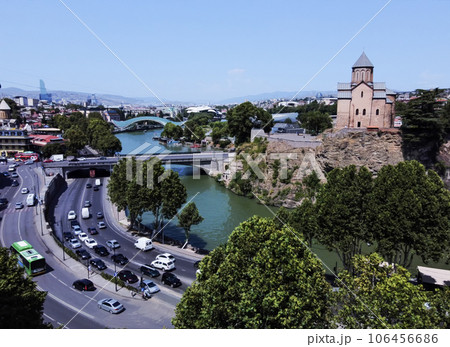 Metekhi church (cathedral) , Metkhi bridge and Kura river and Bridge of Peace in distance and cityscape of Tbilisi Metekhi church (cathedral) , Metkhi bridge and Kura river and Bridge of Peace in distance and cityscape of Tbilisi 106456686