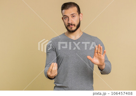 Lebanese man saying no, be careful, scolding and giving advice to avoid danger, disapproval sign 106457408