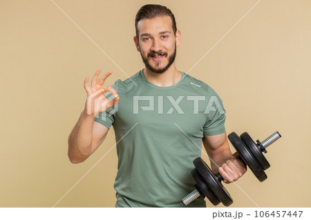 Athlete sportive man looking at camera showing ok gesture, like sign positive, feedback, celebrate 106457447