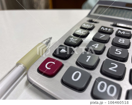 Black calculator in tax managment. Black calculator in tax managment. 106460518