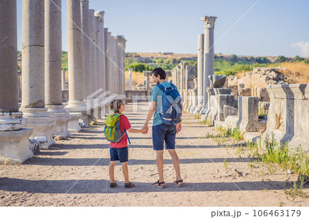 dad and son tourists at the ruins of ancient city of Perge near Antalya Turkey. Traveling with kids concept 106463179