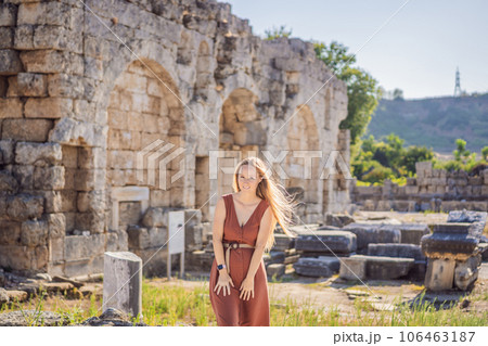 Pretty tourist woman at the ruins of ancient city of Perge near Antalya Turkey Pretty tourist woman at the ruins of ancient city of Perge near Antalya Turkey 106463187