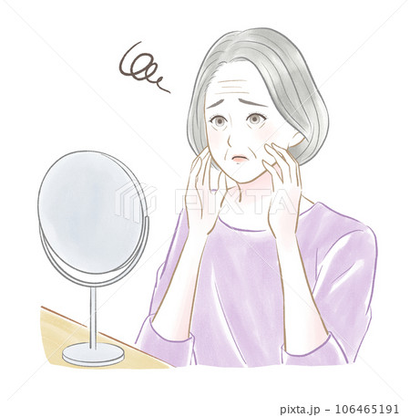 顔を触りながら置き鏡を見てしわに悩む白髪のシニア女性 顔を触りながら置き鏡を見てしわに悩む白髪のシニア女性 106465191