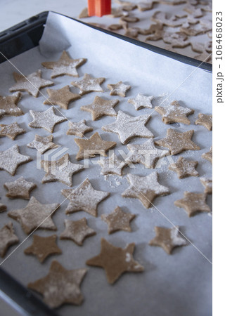 Hands of little 6 years old child with cookies in shape of star. cooking concept Hands of little 6 years old child with cookies in shape of star. cooking concept 106468023