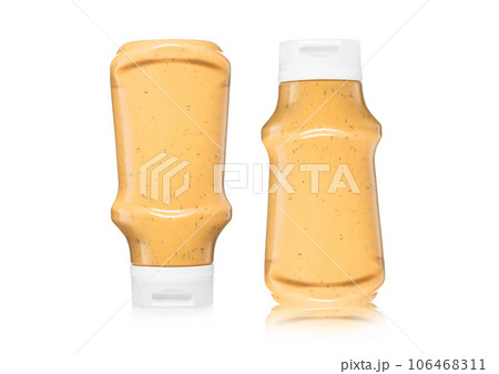 Bottles of creamy american style sauce for burger and fries on white . 106468311