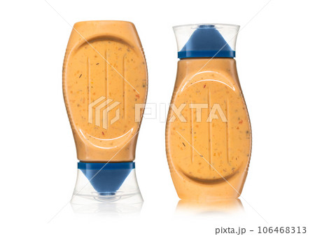 Bottles of creamy sauce suitable for burger and fries on white. 106468313