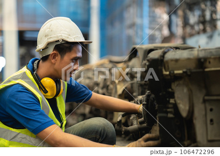 Engineer male worker check inventory store old used auto spare part engine gear part list for sale recycle in repair car garage market Engineer male worker check inventory store old used auto spare part engine gear part list for sale recycle in repair car garage market 106472296