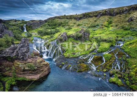Gjain waterfall flowing in Pjorsardalur lush valley during summer at Iceland Gjain waterfall flowing in Pjorsardalur lush valley during summer at Iceland 106474926