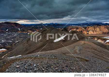 Landscape of volcanic mountain with moody sky on Blahnjukur trail among Icelandic highlands in summer Landscape of volcanic mountain with moody sky on Blahnjukur trail among Icelandic highlands in summer 106474927