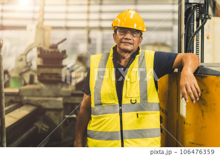 portrait happy senior Asian engineer worker adult staff working in heavy industry with safety portrait happy senior Asian engineer worker adult staff working in heavy industry with safety 106476359
