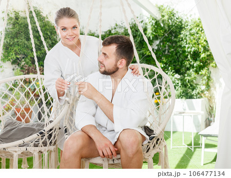 Couple enjoying vacation in spa resort outdoors Couple enjoying vacation in spa resort outdoors 106477134