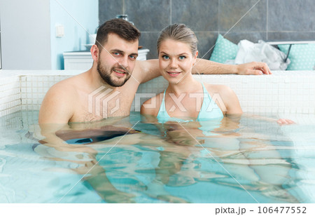 Couple relaxing in hot tub Couple relaxing in hot tub 106477552